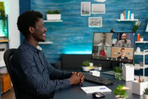 African student having online videocall meeting conference